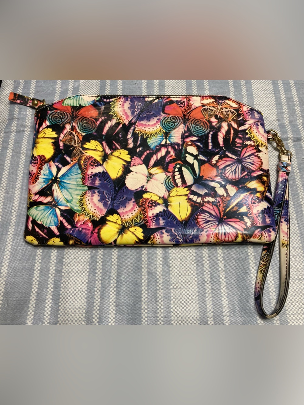 Lodis multicolor butterfly wristlet.